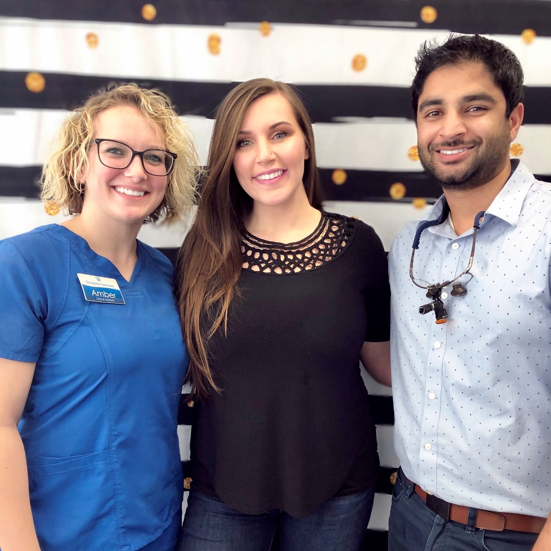 Dr. Patel with a patient and staff member